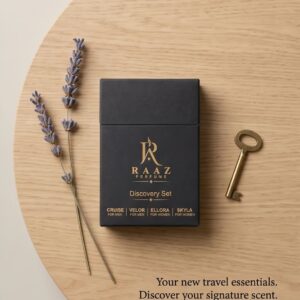 RAAZ Perfume Discovery Set on a wooden tray with lavender and a vintage key